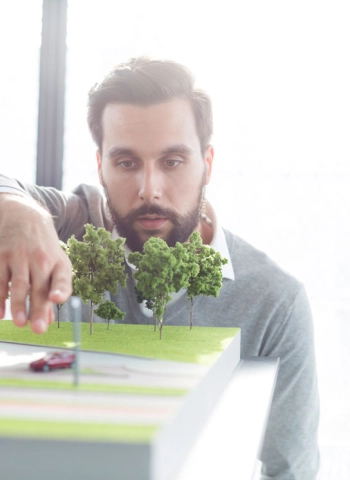 Businessman-at-building-model