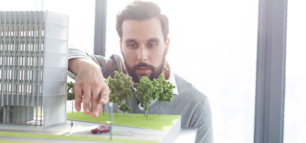 Business-man-building-model-architect